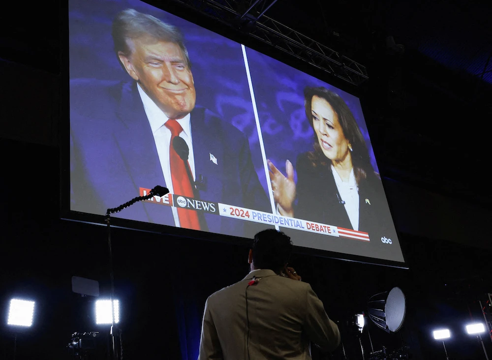 A screen displays the presidential debate hosted by ABC between Republican presidential nominee Donald Trump and Democratic presidential nominee Kamala Harris in Philadelphia, Pennsylvania on Sep. 10, 2024. (Reuters)