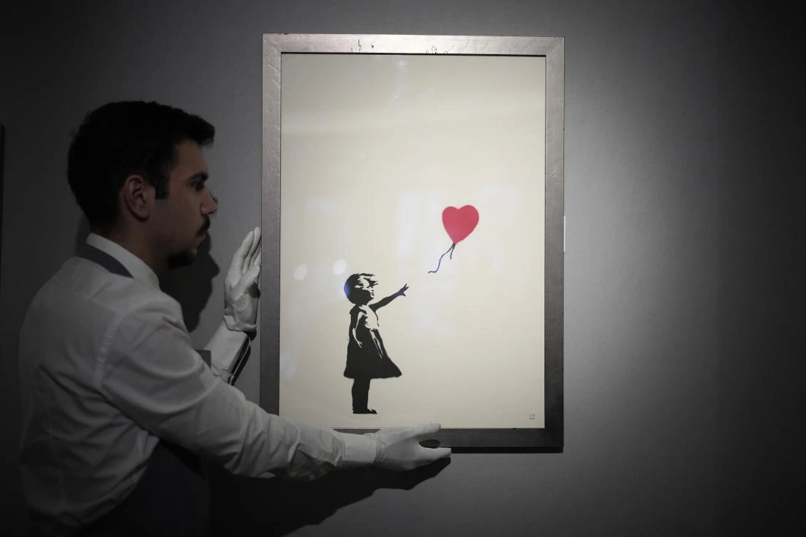 Bansky, who has never confirmed his full identity, began his career spray-painting buildings in Bristol, England, and has become one of the world’s best-known artists. (AP)