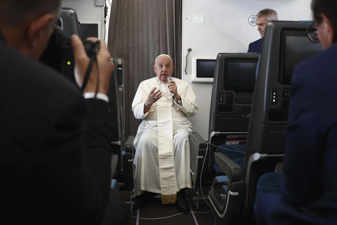 Pope Francis holds a news conference aboard the papal plane on his flight back after his 12-day journey across Southeast Asia and Oceania, on Sept. 13, 2024. (AP)
