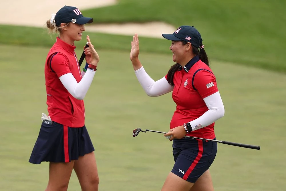 Allisen Corpuz and Nelly Korda of Team United States react to a putt on the 14th green during the Friday foursomes matches against Team Europe in the first round of the Solheim Cup 2024 at Robert Trent Jones Golf Club on Sept. 13, 2024. (Getty Images North America/AFP)