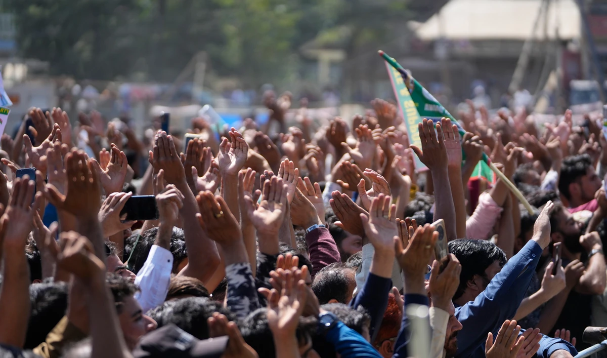 Supporters of Awami Ittehad Party (AIP) leader Sheikh Abdul Rashid cheer during a public rally at Baramulla some 55 kilometers (34 miles) north of Srinagar, Indian controlled Kashmir, Thursday, Sept. 12, 2024. (AP)