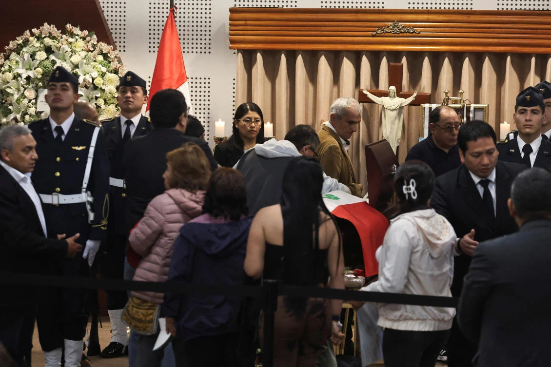 Thousands of admirers queued at the National Museum in Lima on Thursday and Friday to pay their respects at former President Alberto Fujimori’s open casket. (Reuters)