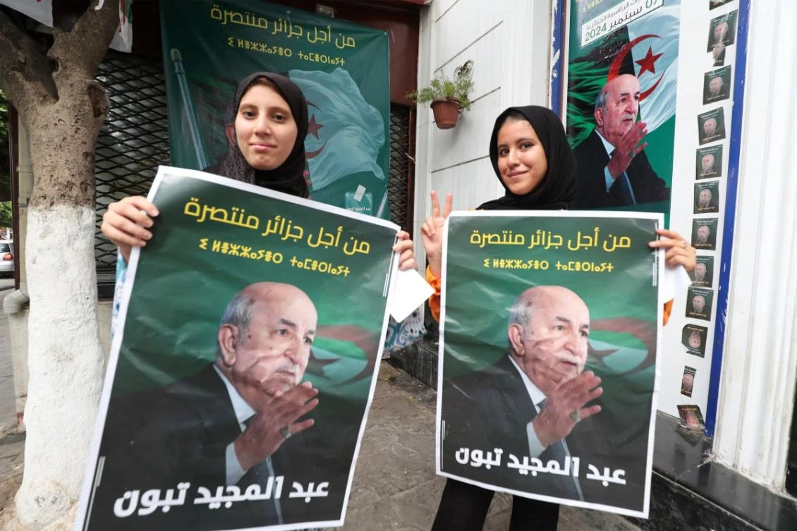 Supporters of Algeria's President Abdelmajid Tebboune celebrate his reelection victory outside a campaign headquarters in Algiers on September 8, 2024. (AFP)