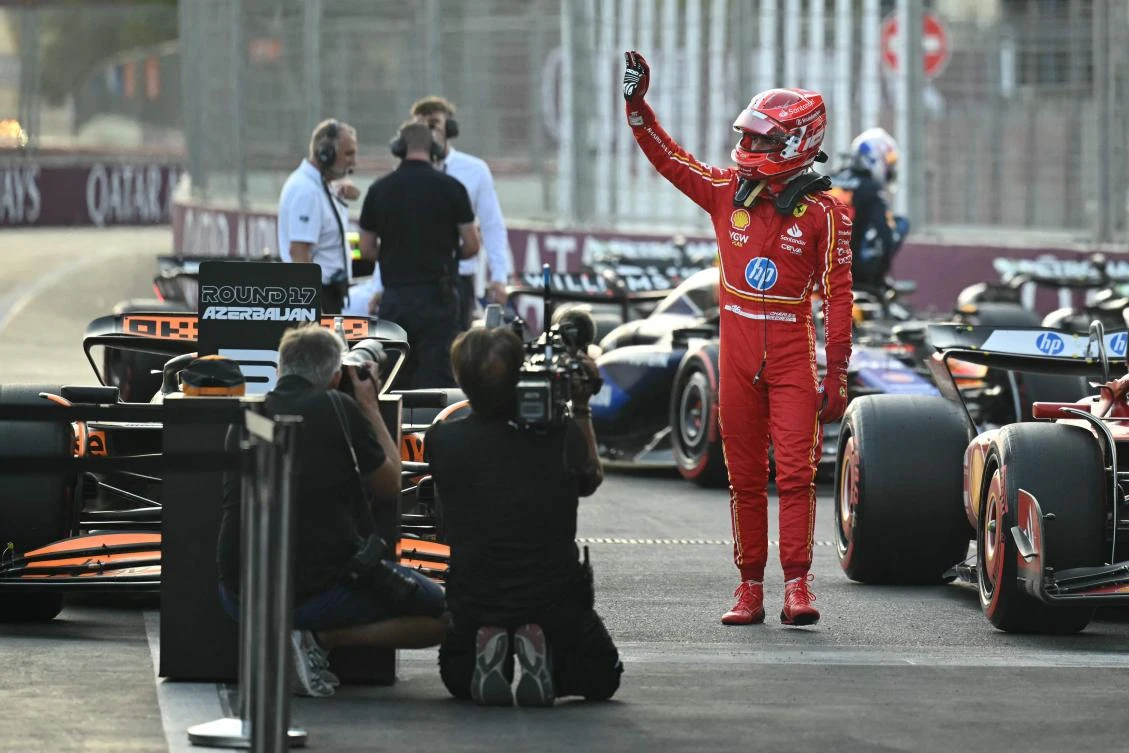 Ferrari’s Monegasque driver Charles Leclerc celebrates his pole position after the qualifying session ahead of the Formula One Azerbaijan Grand Prix at the Baku City Circuit in Baku on September 14, 2024. (AFP)
