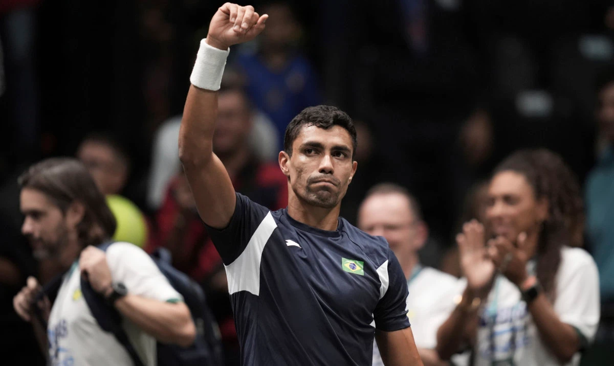 Brazil’s Thiago Monteiro celebrates after beating Belgium’s Zizou Bergs during their Davis Cup tennis match at the Unipol Arena, in Bologna, Italy, on Sept. 14, 2024. (AP)