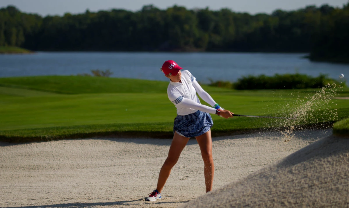Nelly Korda of Team USA plays a shot from a bunker on the 12th hole during foursomes matches against Team Europe during the second round of the Solheim Cup 2024 at Robert Trent Jones Golf Club Saturday. (Reuters)