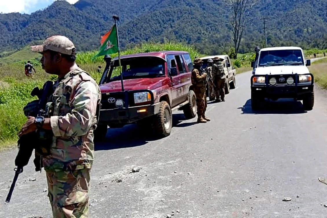 This handout picture released by the Royal Papua New Guinea Constabulary on February 19, 2024 shows officials patrolling near the town of Wabag, 600 kilometres northwest of the capital Port Moresby. (AFP)