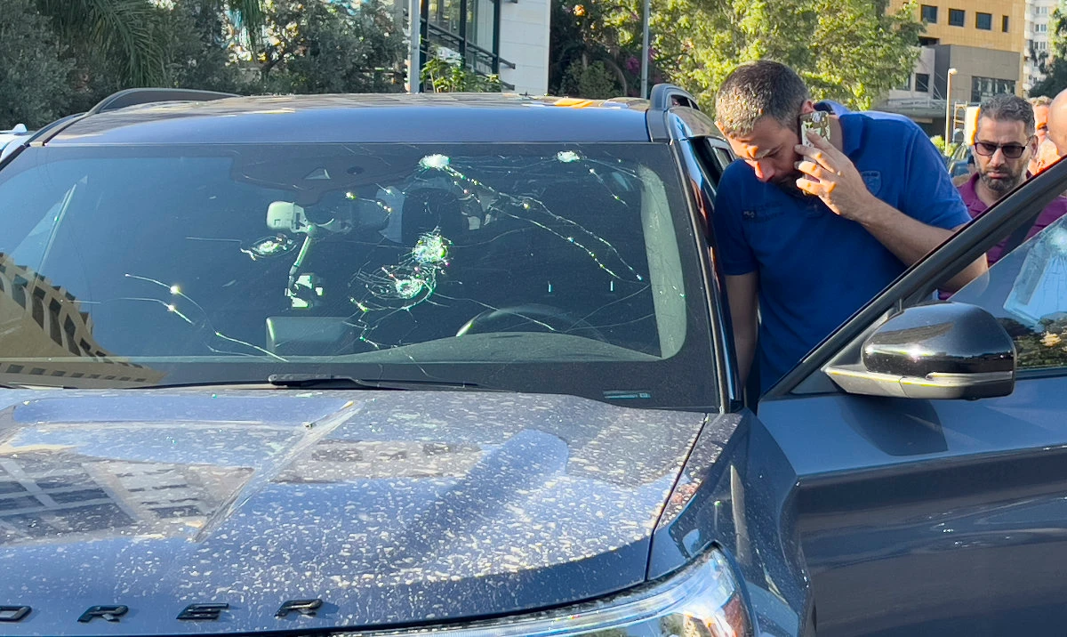 Police officers inspect a car inside of which a hand-held pager exploded, Beirut, Lebanon, Tuesday, Sept. 17, 2024. (AP)