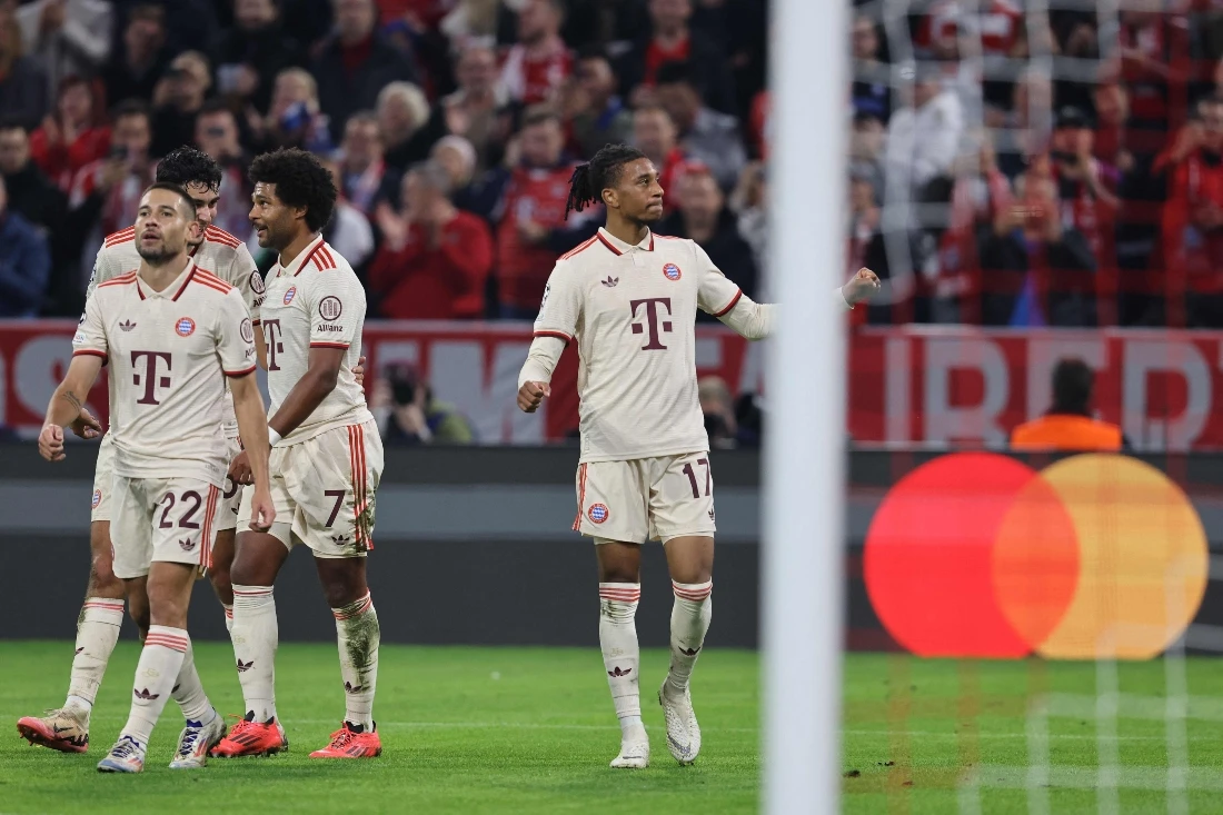 Bayern Munich's French midfielder Michael Olise (R) celebrates scoring the 5-2 goal with his teammates during the UEFA Champions League football match FC Bayern Munich vs. GNK Dinamo Zagreb in Munich on Sept. 17, 2024. (AFP)