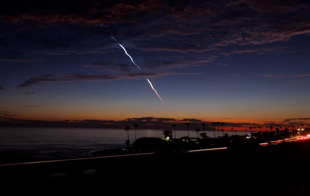 An evening launch of a SpaceX Falcon 9 rocket carrying 20 Starlink V2 Mini satellites is seen over the Pacific Ocean from Encinitas, California, US, June 23, 2024. (Reuters)