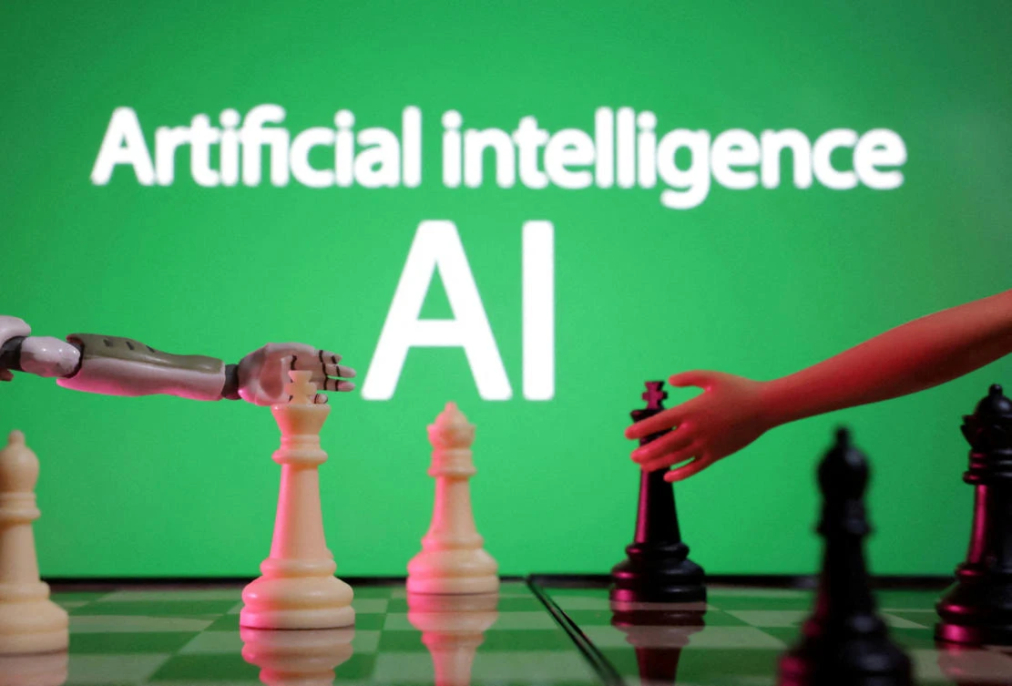 FILE PHOTO: Words reading "Artificial intelligence AI," miniature of robot and toy hand are picture in this illustration taken December 14, 2023. (REUTERS)