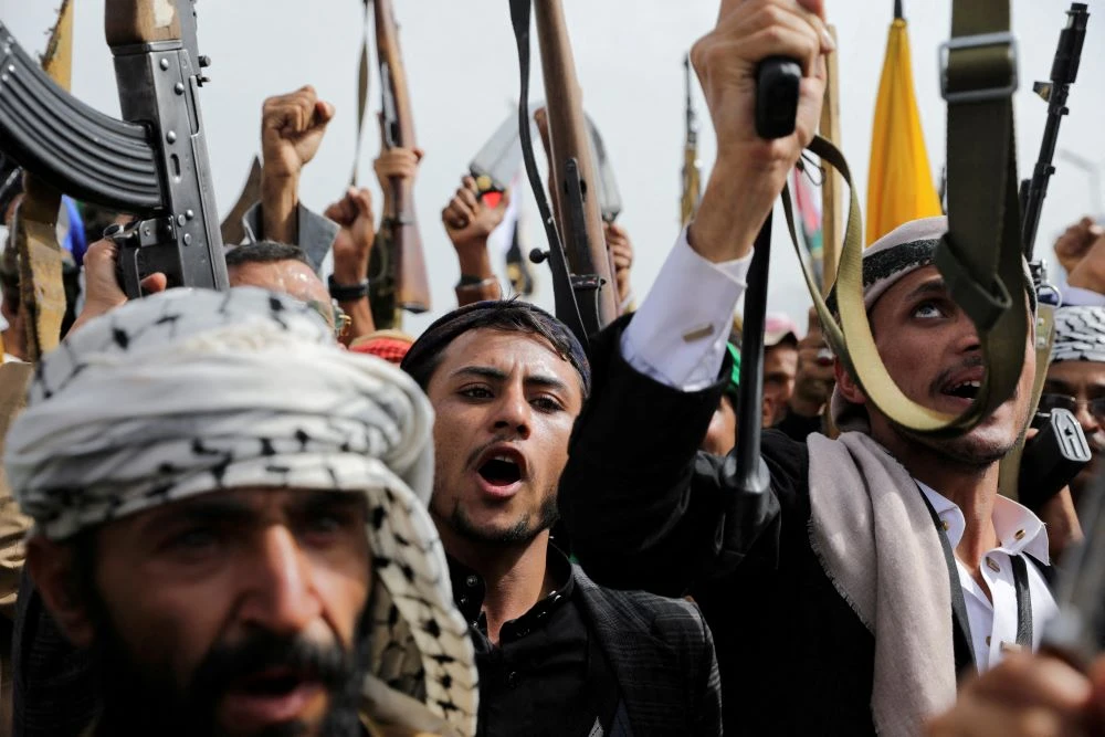 Houthi militants brandish their weapons during a rally in Sanaa, Yemen, Aug. 30, 2024. (Reuters)