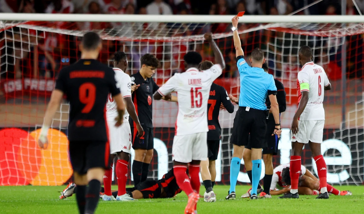 Barcelona's Eric Garcia is shown a red card by referee Allard Lindhout. (Reuters)