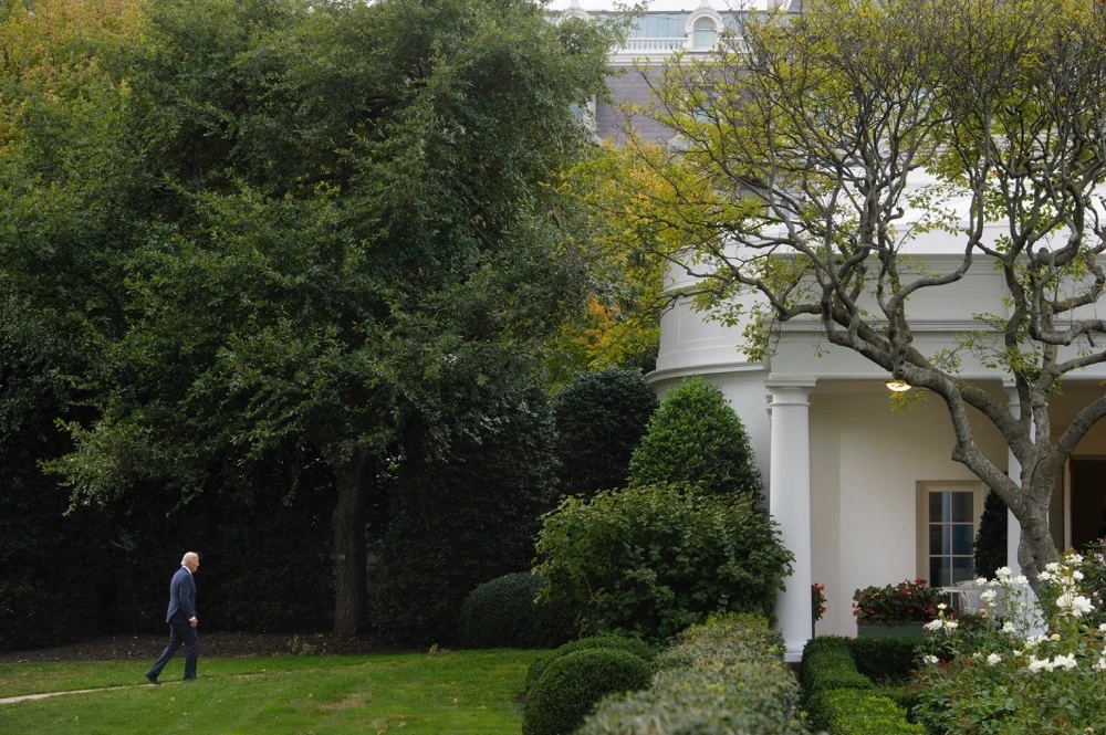 President Joe Biden walks to the Oval Office as he arrives at the White House in Washington. (AP)
