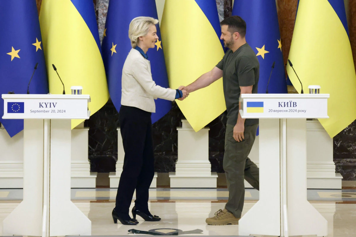 European Commission President Ursula von der Leyen (L) and Ukrainian President Volodymyr Zelensky shake hands after a joint press conference in Kyiv on September 20, 2024. The EU plans to lend Ukraine 35 billion euros ($39 billion), backed by the revenues of Russian assets frozen in the bloc. (AFP)