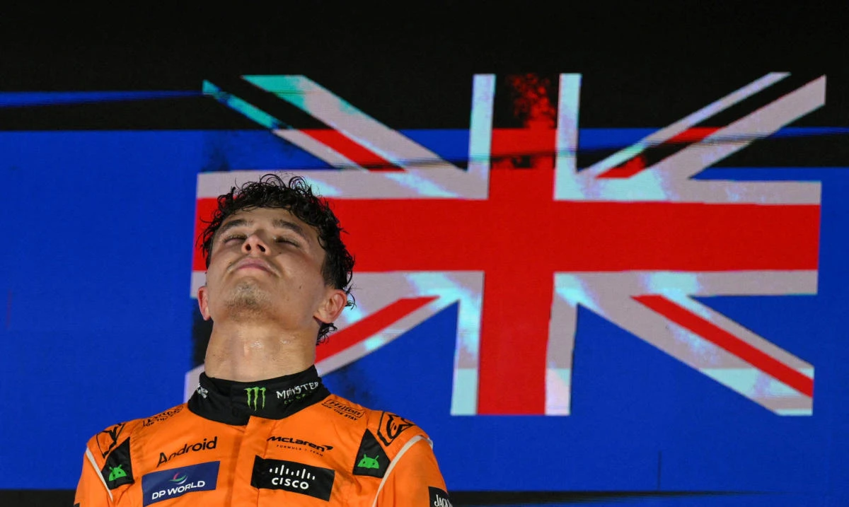 McLaren’s Lando Norris celebrates on the podium after winning the Singapore Grand Prix. (Reuters)