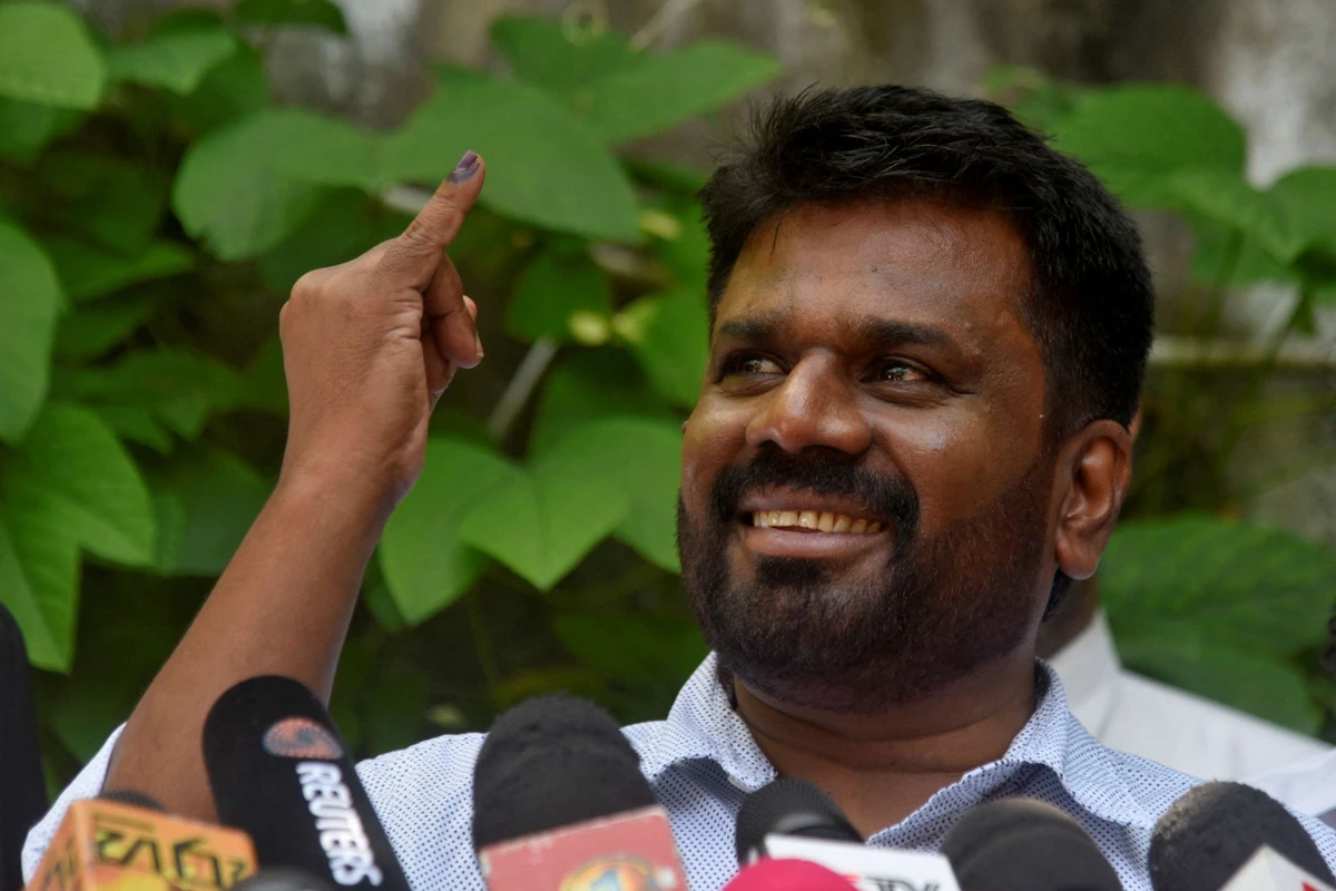 Sri Lanka's new president Anura Kumara Dissanayake shows his ink-marked finger after casting his vote at a polling station, on the day of the presidential election, in Colombo, Sri Lanka on Sept. 21, 2024. (Reuters)