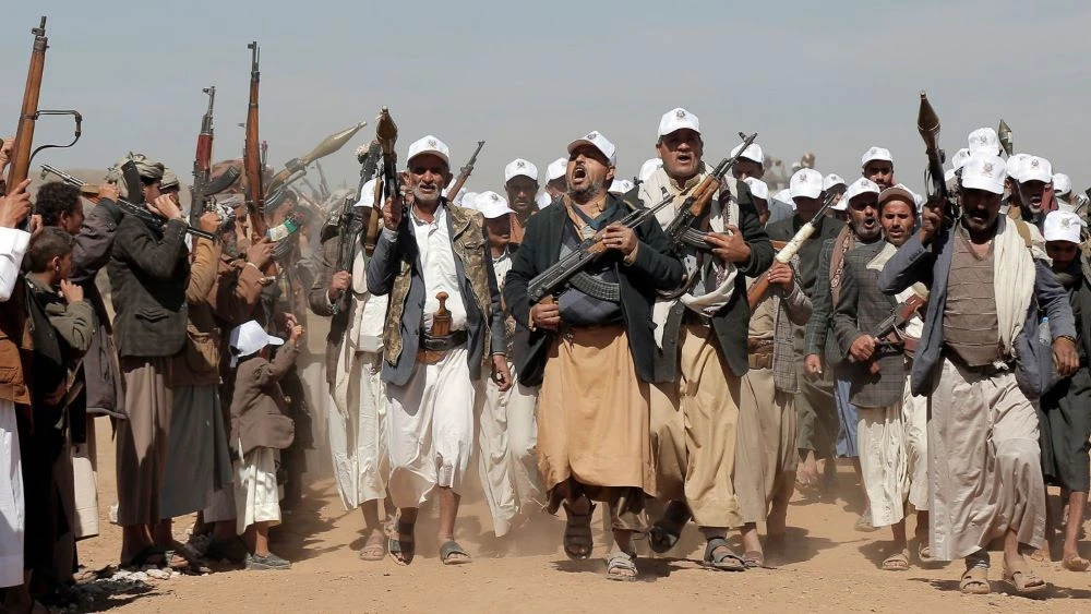 Houthi fighters march during a rally outside of Sanaa, Yemen, Jan. 22, 2024. (AP Photo)