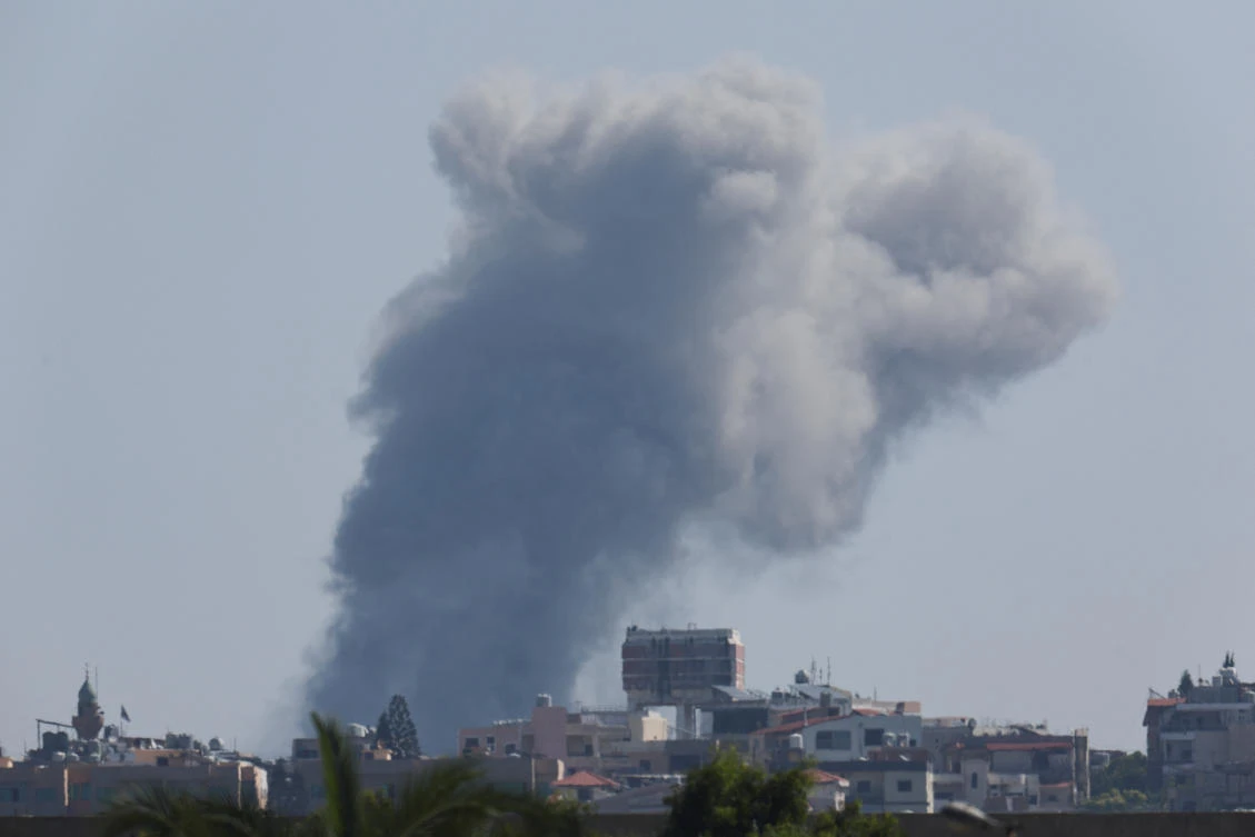 Smoke billows over southern Lebanon following an Israeli strike as seen from Tyre, on Sept. 27, 2024. (Reuters)