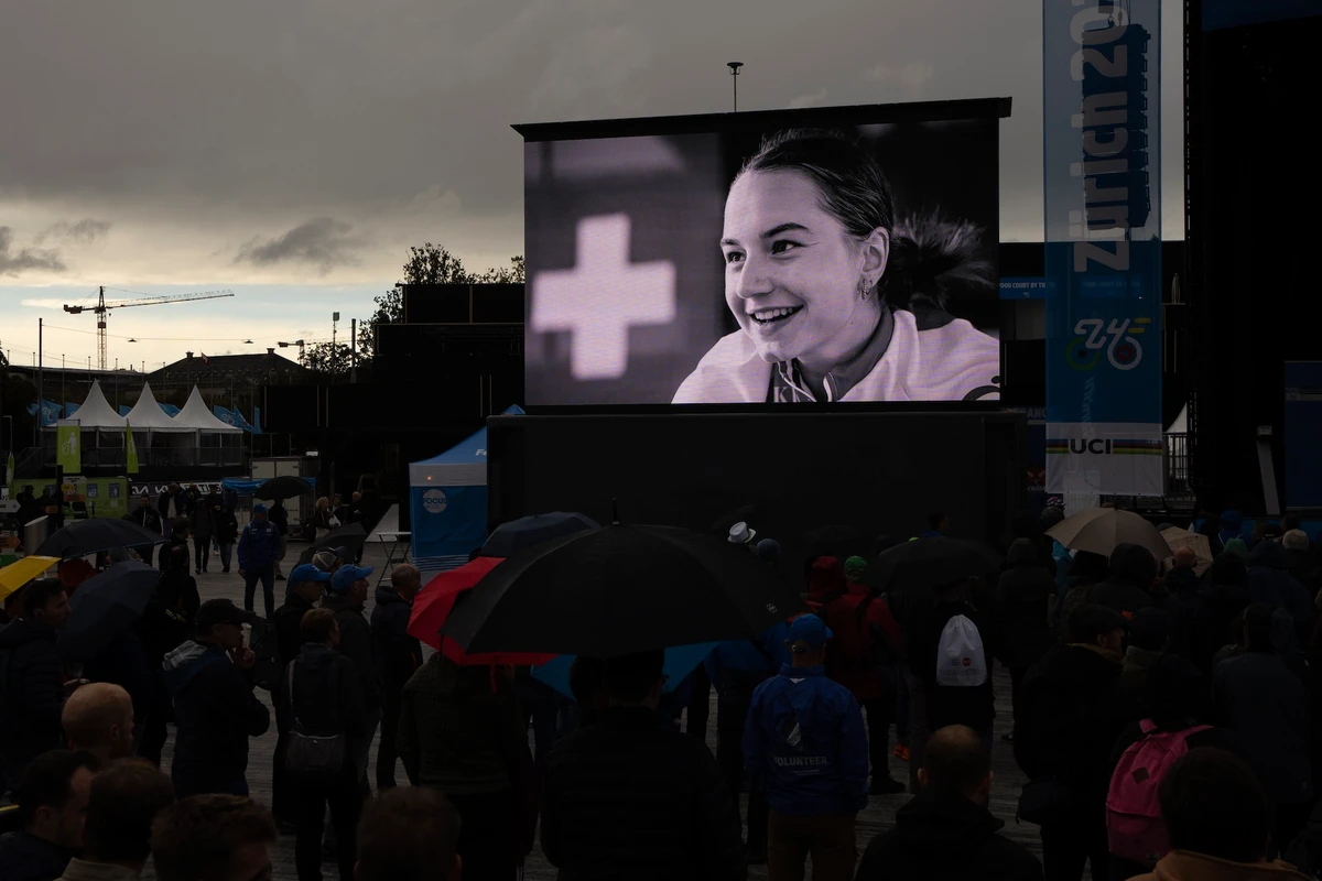 A picture of cyclist Muriel Furrer from Switzerland, who died after a crash Thursday, is projected during a minute of silence prior to the medal ceremony of the Men Under 23 Road Race of the Cycling and Para-cycling Road World Championships in Zurich Friday. (AP)
