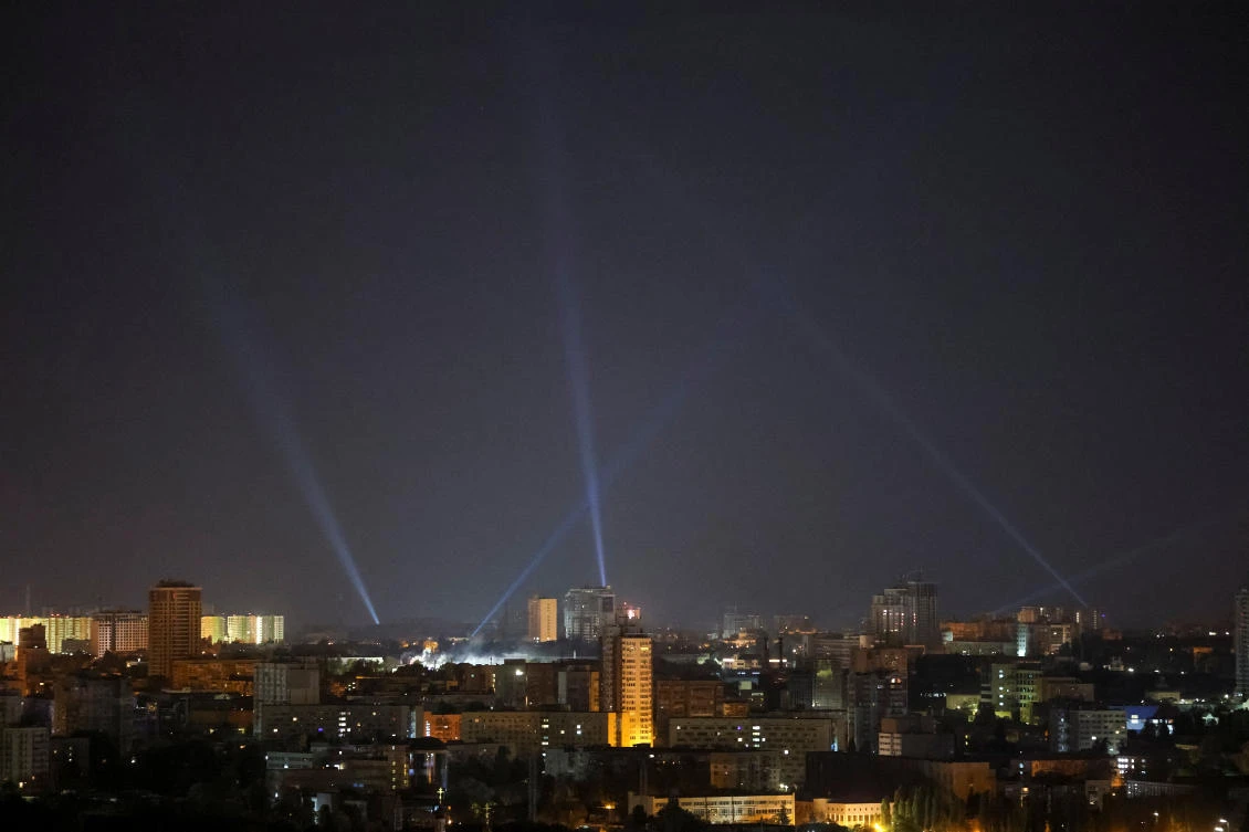Ukrainian service personnel use searchlights as they search for drones in the sky over the city centre during a Russian drone strike, amid Russia's attack on Ukraine, in Kyiv, Ukraine September 28, 2024. (Reuters)
