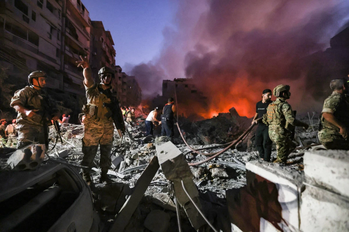 Lebanese army soldiers gather to search the rubble of leveled buildings following Israeli air strikes in the Haret Hreik neighborhood of Beirut's southern suburbs on September 27, 2024. (AFP)