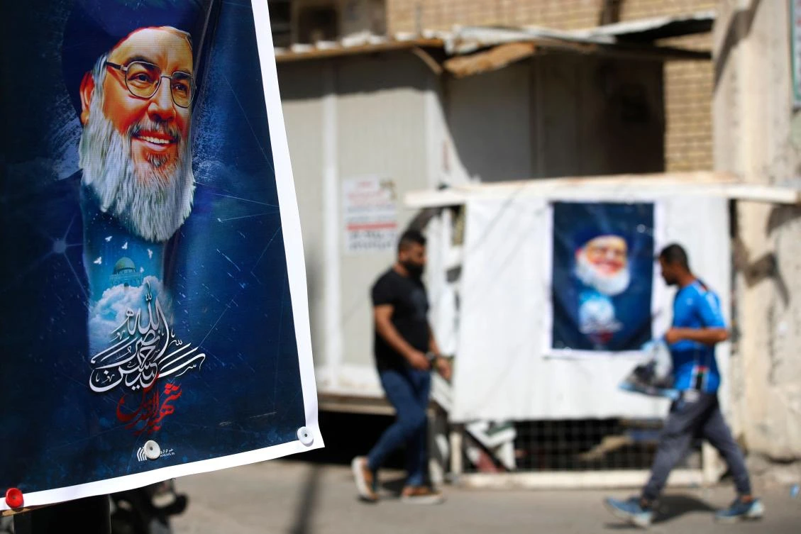 A portrait of Hezbollah's leader Hassan Nasrallah hangs on a street in Baghdad on September 29, 2024. (AFP)