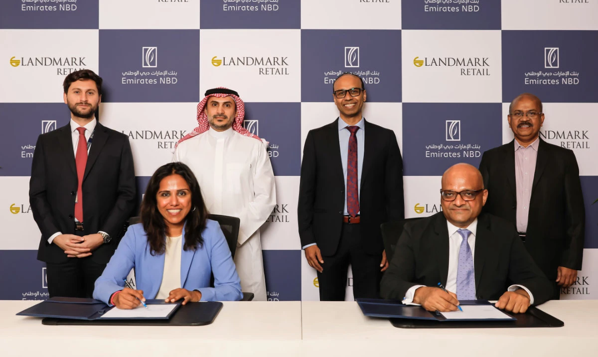 The agreement was signed in the presence of officials from both companies.