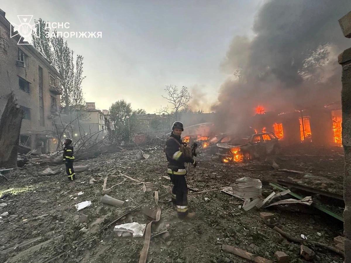 In this photo provided by the Ukrainian Emergency Service, firefighters put out the fire after Russia attacked the city with guided bombs overnight in Zaporizhzhia on Sept. 29, 2024. Russian forces later struck Kyiv early Monday. (Ukrainian Emergency Service via AP)