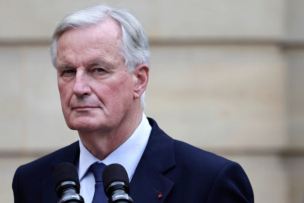 New French prime minister Michel Barnier looks on during the handover ceremony. (AP)