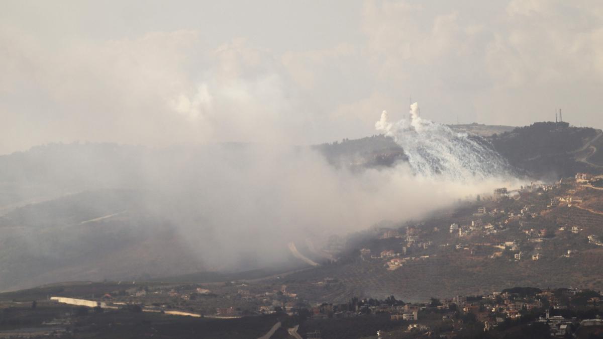 Smoke rises from the site of Israeli artillery shelling on the southern villages of Adeisseh and Kfar Kila along the border with Israel on October 1, 2024. (AFP)