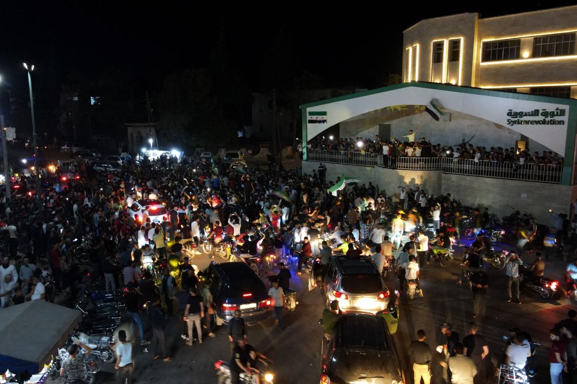 Syrians gather in the rebel-held northwestern city of Idlib in the early hours of September 28, 2024, following news claiming the death of Lebanon's Hezbollah chief Hassan Nasrallah in an Israeli airstrike on Beirut's southern suburbs on September 27. (File/AFP)