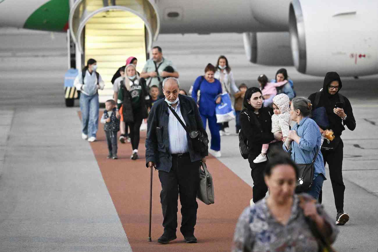Passengers disembark a Bulgarian government evacuation flight from Lebanon at Sofia airport on September 30, 2024. (AFP)