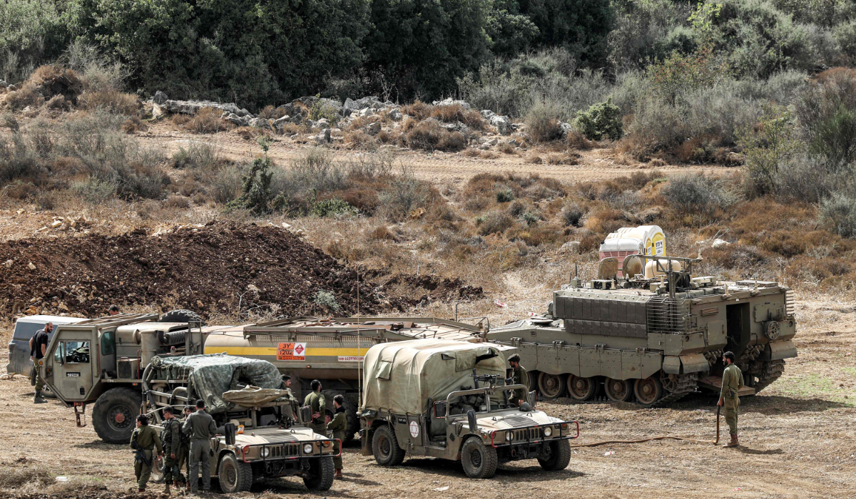 Israeli army vehicles deploy at a position along the border with Lebanon in northern Israel on October 1, 2024. (AFP)