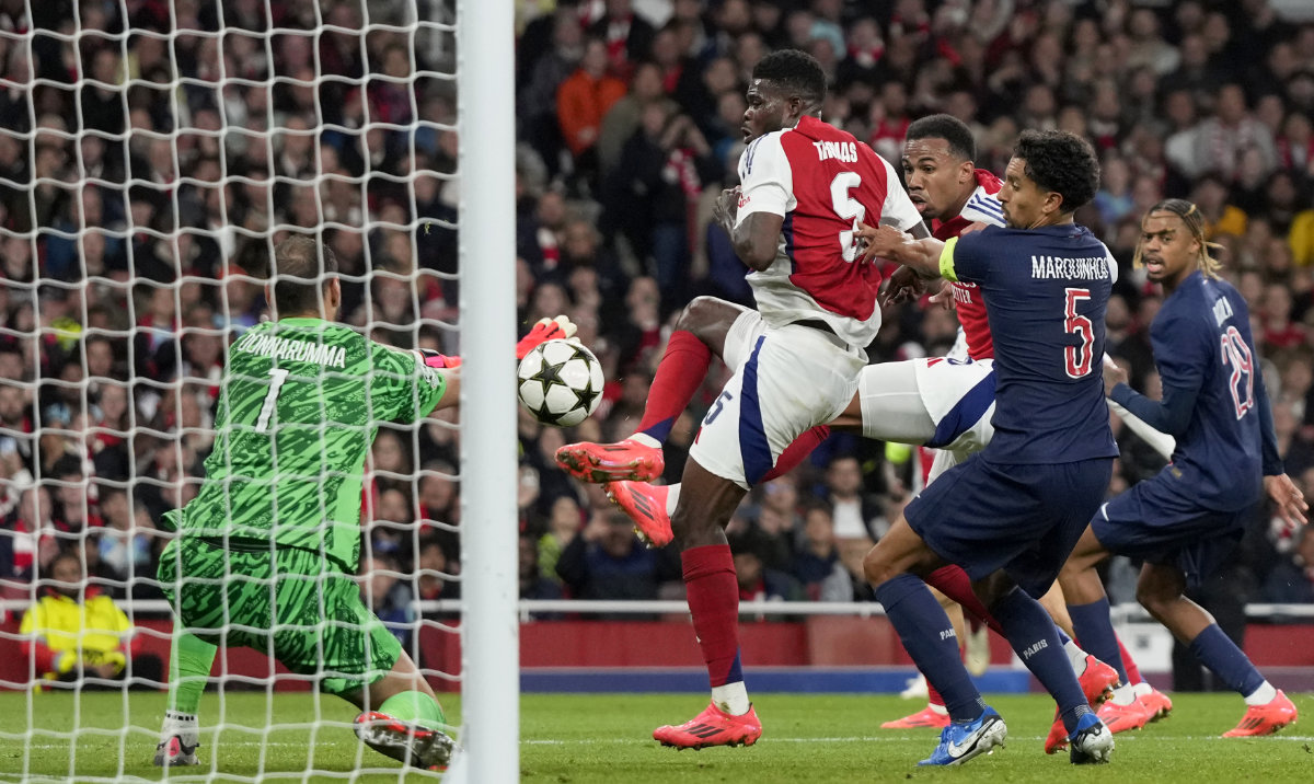 PSG's goalkeeper Gianluigi Donnarumma fails to stop a free kick by Arsenal's Bukayo Saka to concede a second goal during a Champions League opening phase soccer match between Arsenal FC and Paris Saint-Germain at Arsenal stadium in London, England, Tuesday, Oct. 1, 2024. (AP)