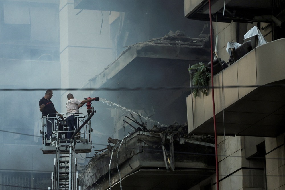 Rescuers work at a site of an Israeli strike, amid ongoing cross-border hostilities between Hezbollah and Israeli forces, in south Beirut, Lebanon. (Reuters)