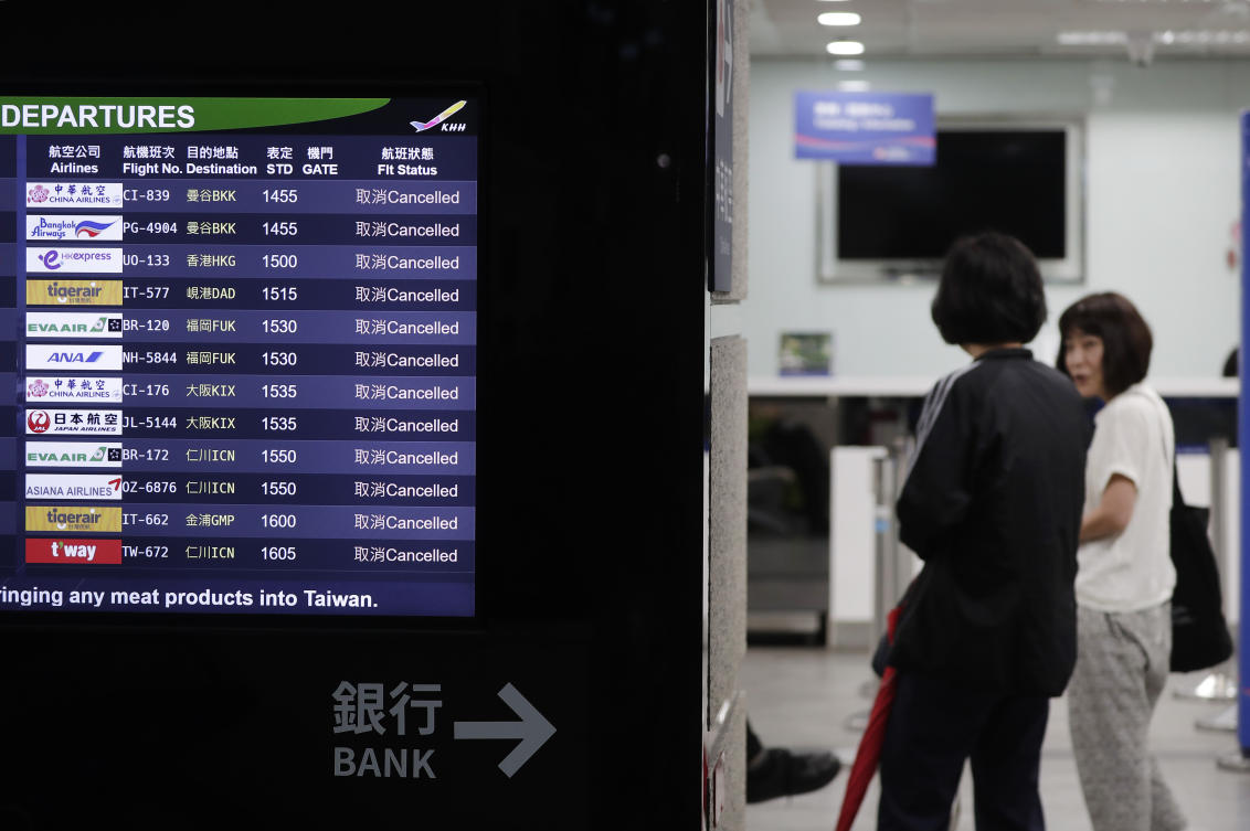 All Taiwan’s cities and counties declared a day off, shutting financial markets and canceling domestic flights, along with 246 international ones. (AP)