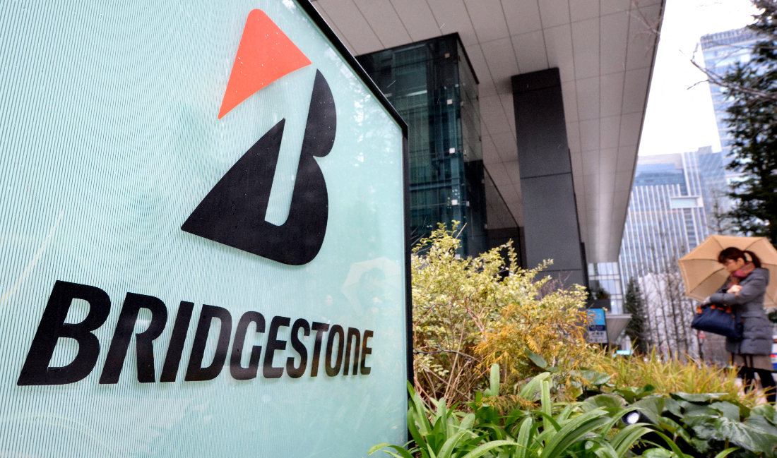 Tire giant Bridgestone has become the latest Japanese firm to end its Olympics sponsorship. The decision comes after Japanese electronics giant Panasonic and auto titan Toyota said last month they had decided to end their top-tier Olympic sponsorship. (File/AFP)