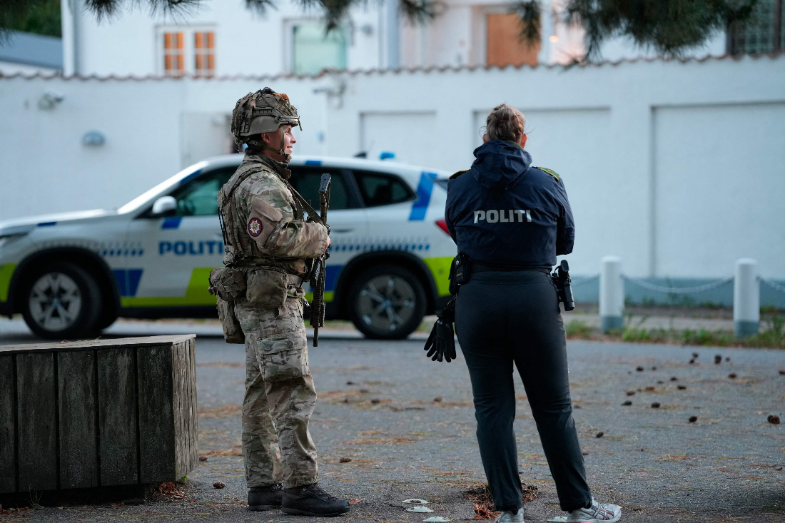Police officers are seen securing an area near the Israeli embassy in Copenhagen, on October 2, 2024. (AFP)