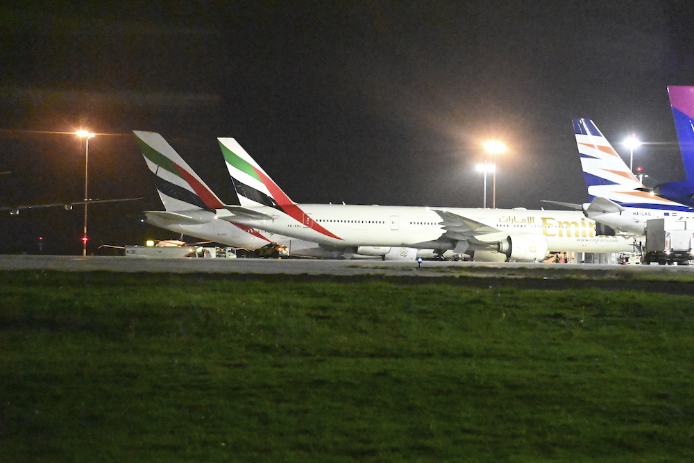 Two Emirates aircraft sit on the tarmac at Liszt Ferenc Airport in Budapest, Hungary on Oct. 1, 2024, after three earlier Emirates flights interrupted their journey over Turkiye, turned back and landed in Budapest due to the conflict in the Middle East. (MTI via AP)