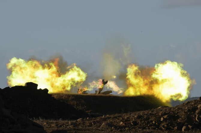 An Israeli mobile artillery unit fires a shell from northern Israel towards Lebanon. (File/AP)