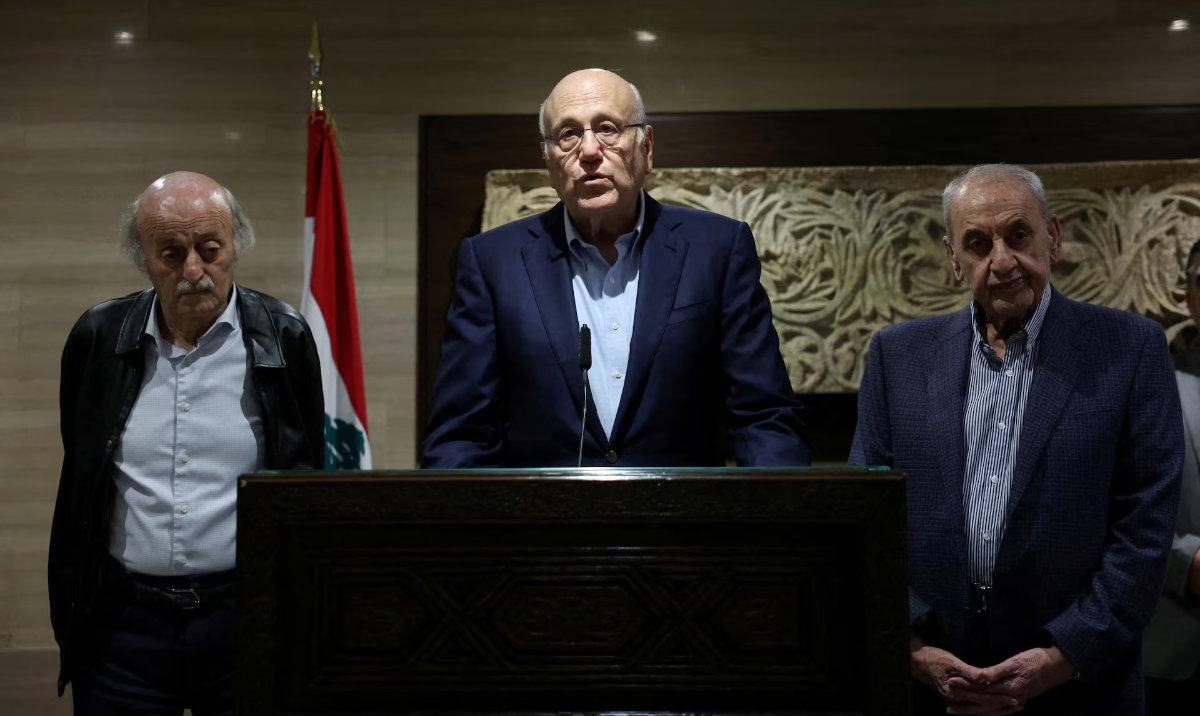 Lebanon's caretaker Prime Minister Najib Mikati stands next to Lebanese Parliament Speaker Nabih Berri (R), and Lebanese Druze leader Walid Jumblatt, as he speaks during a press conference in Beirut, Lebanon October 2, 2024. (Reuters)