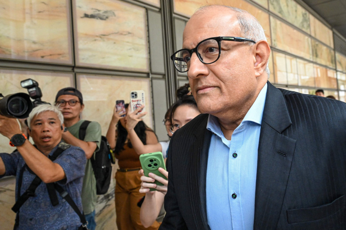 Singapore's former transport minister S. Iswaran arrives for sentencing at the Supreme Court in Singapore on October 3, 2024. (AFP)