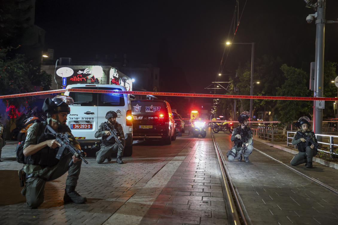 Israeli policemen take position after a shooting attack in Jaffa, a mixed Arab-Jewish area of Tel Aviv, Israel, Tuesday, Oct. 1, 2024. (AP)