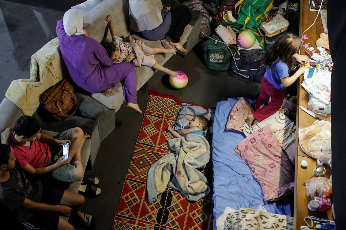 A displaced family rests at the famous Skybar club, which became a shelter for the displaced who fled, amid ongoing hostilities between Hezbollah and Israeli forces in Beiruts southern suburbs and its surroundings, in Beirut, Lebanon October 2, 2024. (REUTERS)