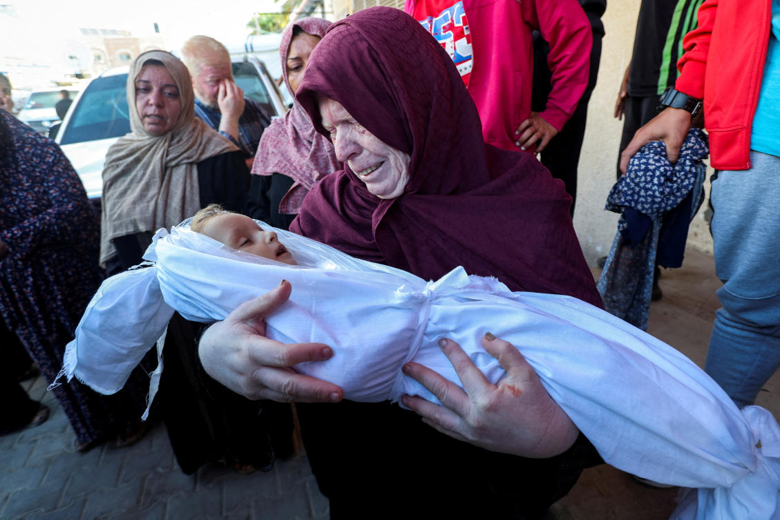 A relative reacts as she holds the body of Palestinian boy Joud Hasaneen, who medics said was killed in an Israeli strike, amid the Israel-Hamas conflict, at Al-Aqsa Martyrs Hospital in Deir Al-Balah in the central Gaza Strip, October 2, 2024. (REUTERS)