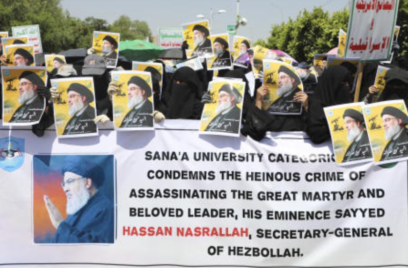 Houthi supporters raise pictures of slain Hezbollah leader Hassan Nasrallah, during an anti-Israel rally in Sanaa on Oct. 2, 2024. (AP)