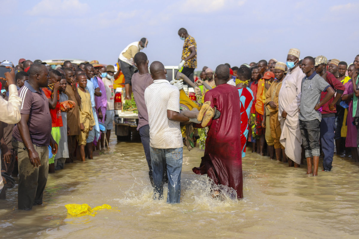 In this photo taken on May 26, 2021, responders retrieve victims of a boat accident in Africa's Niger River. (AFP/File)
