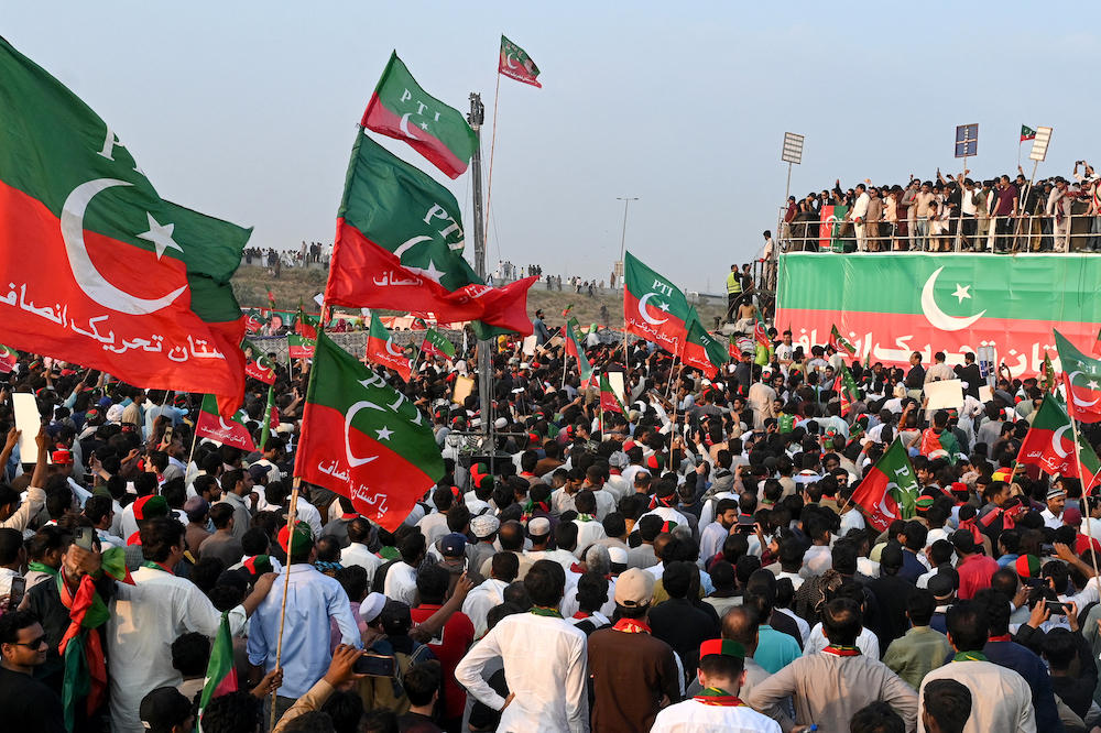 Activists of Pakistan Tehreek-e-Insaf party of former prime minister Imran Khan take part in a public rally on the outskirts of Lahore on Sept. 21, 2024. (AFP)