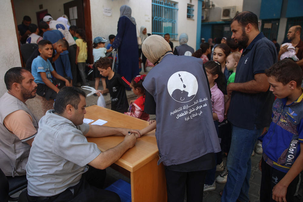 Polio vaccination coverage in Gaza has reached 90 percent, the head of the UN Palestinian refugee agency earlier said. Above, medics administer polio vaccines to children at the Al-Daraj neighborhood clinic in Gaza City on Sept. 10, 2024. (AFP)
